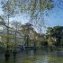 Palacio de Cristal in the Buen Retiro Park in central Madrid. It is made of glass set in an iron framework on a brick base, which is decorated with ceramics.